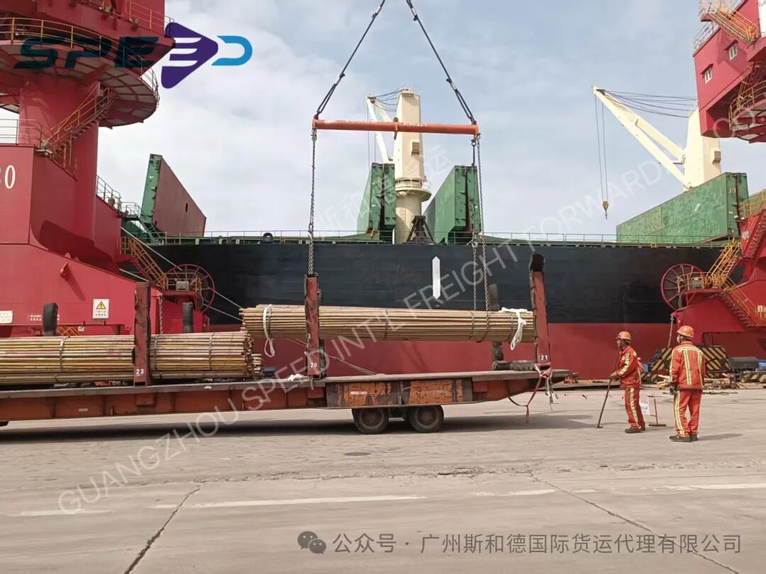 Scaffolding pipes being loaded by crane at the port